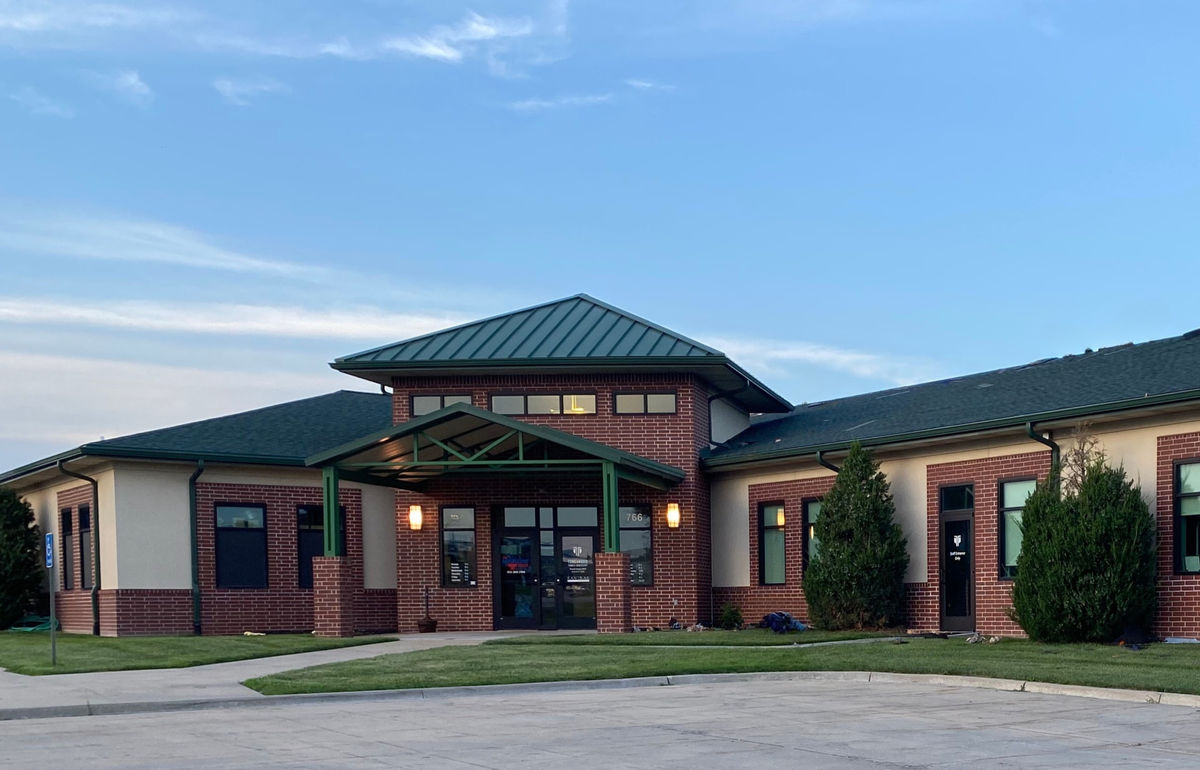 Standing seam metal roof installation on a Kansas City building