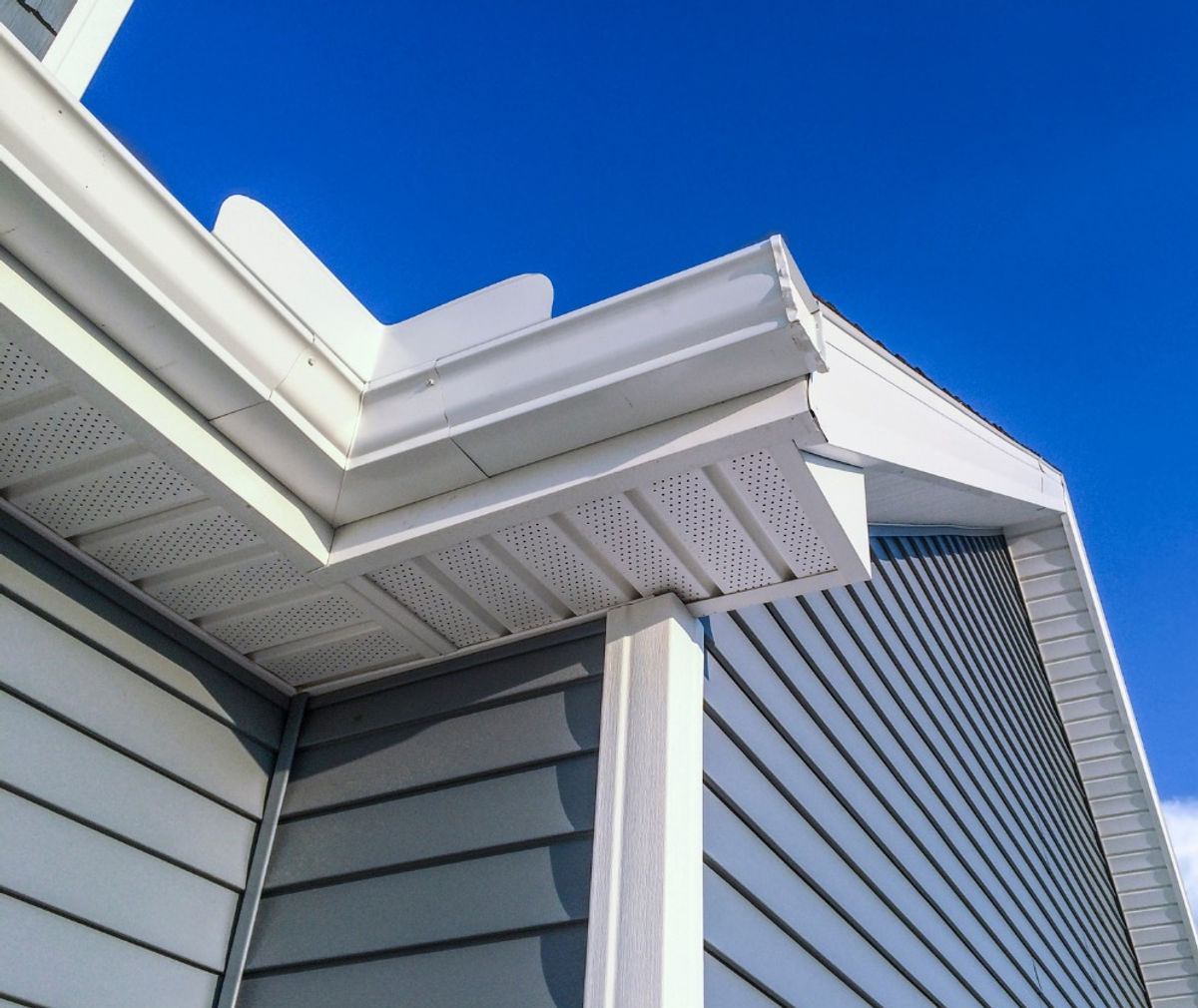 Clean seamless aluminum gutter and soffit installation